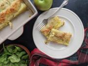 Crepe-like phyllo rolls are stuffed with a mixture of apples, shredded cheese, spinach, and ham, then topped with beaten eggs.