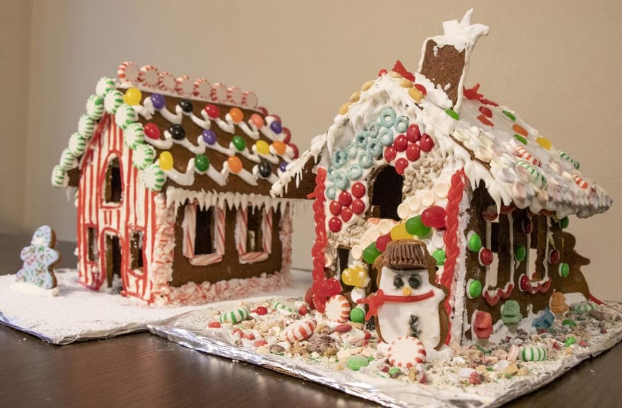 Two completed gingerbread houses. Ours is on the right and our roommates&#039; is on the left.