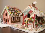 Two completed gingerbread houses. Ours is on the right and our roommates&#039; is on the left.