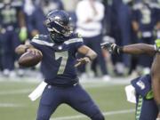 Seattle Seahawks quarterback Geno Smith drops back to pass against the New York Jets during the second half of an NFL football game, Sunday, Dec. 13, 2020, in Seattle.