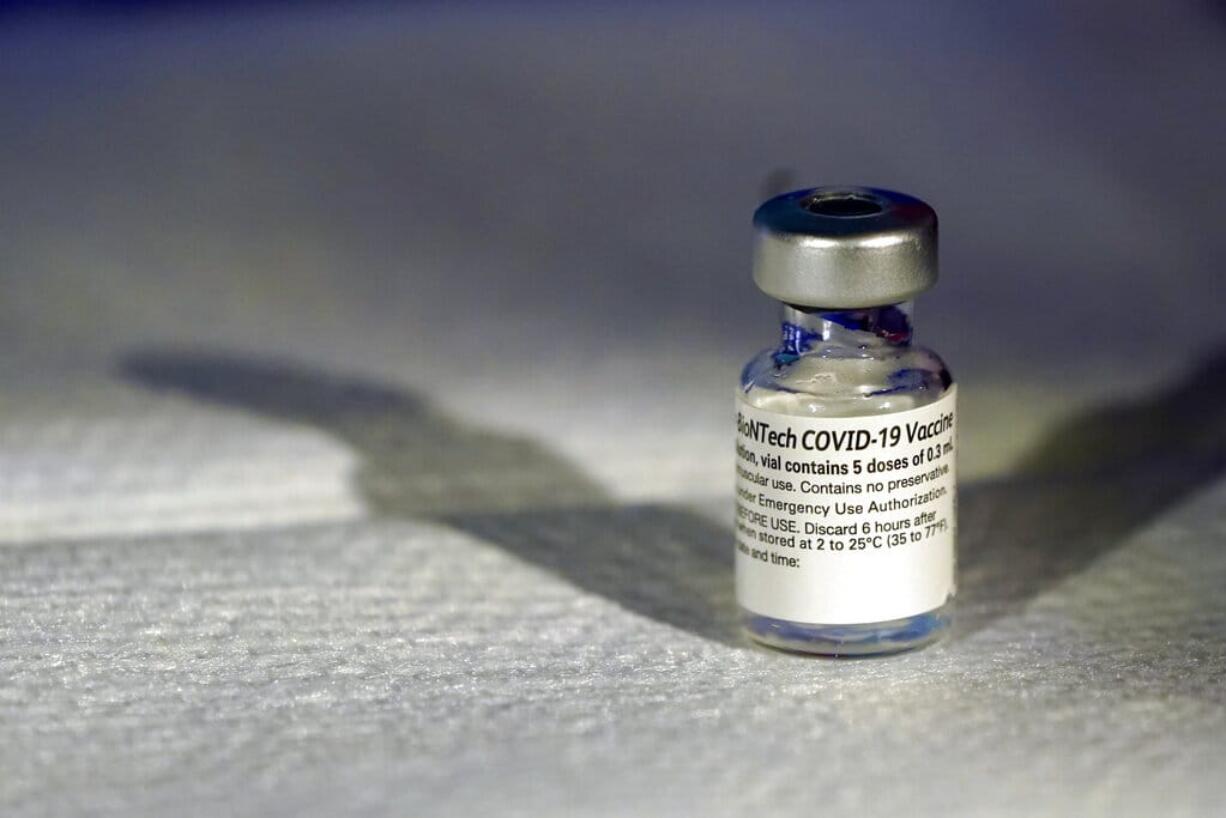 A vial of Pfizer's COVID-19 vaccine that receivedemergency use authorization is seen at George Washington University Hospital, Monday, Dec. 14, 2020, in Washington.