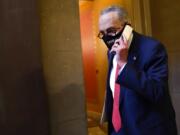 Senate Minority Leader Sen. Chuck Schumer of N.Y., walks on Capitol Hill in Washington, Tuesday, Dec. 15, 2020.