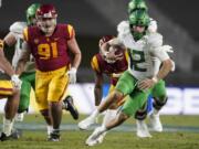 Oregon quarterback Tyler Shough (12) runs the ball during the second half of an NCAA college football game for the Pac-12 Conference championship against Southern California Friday, Dec 18, 2020, in Los Angeles.