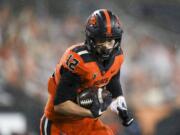 Oregon State inside linebacker Jack Colletto (12) rushes for a touchdown during the second half of an NCAA college football game against Arizona State in Corvallis, Ore., Saturday, Dec. 19, 2020. Arizona State won 46-33.