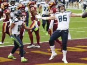 Seattle Seahawks tight end Jacob Hollister (86) celebrates after scoring a touchdown during an NFL football game against the Washington Football Team, Sunday, Dec. 20, 2020 in Landover, Md.