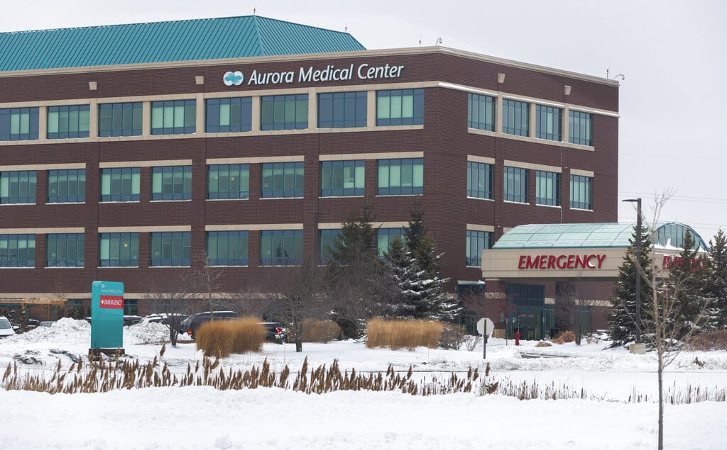 This Thursday, Dec. 31, 2020 photo shows the Aurora Medical Center in Grafton, Wis. A pharmacist at the suburban Milwaukee medical center deliberately removed hundreds of coronavirus vaccine doses from refrigeration and left them out overnight twice, not just once as officials initially believed, the health system's chief medical officer said Thursday.