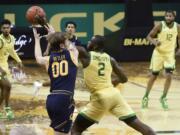 Oregon Ducks forward Eugene Omoruyi (2) steals the ball from California Golden Bears guard Eugene Omoruyi(00) during the first half of their Pac 12 Conference game at Matthew Knight Arena in Eugene, Oregon December 31, 2020.