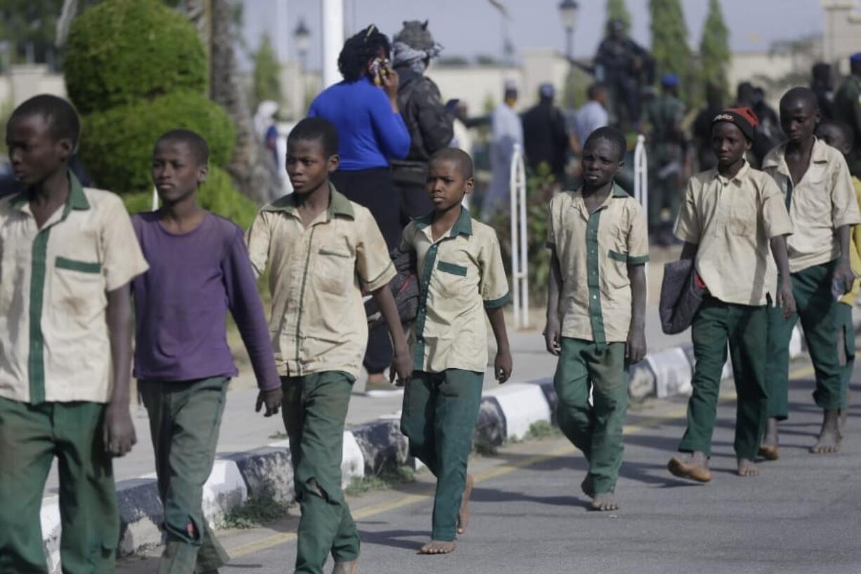 A group of schoolboys are escorted by Nigerian military and officials following their release after they were kidnapped last week, Friday Dec. 18, 2020 in Katsina, Nigeria. More than 300 schoolboys kidnapped last week in an attack on their school in northwest Nigeria have arrived in the capital of Katsina state to celebrate their release. The boys were abducted one week ago from the all-boys Government Science Secondary School in Kankara in Katsina state village. Nigeria&#039;s Boko Haram jihadist rebels claimed responsibility for the abduction. saying they attacked the school because it believes Western education is un-Islamic, factional leader Abubakar Shekau said in a video earlier this week.