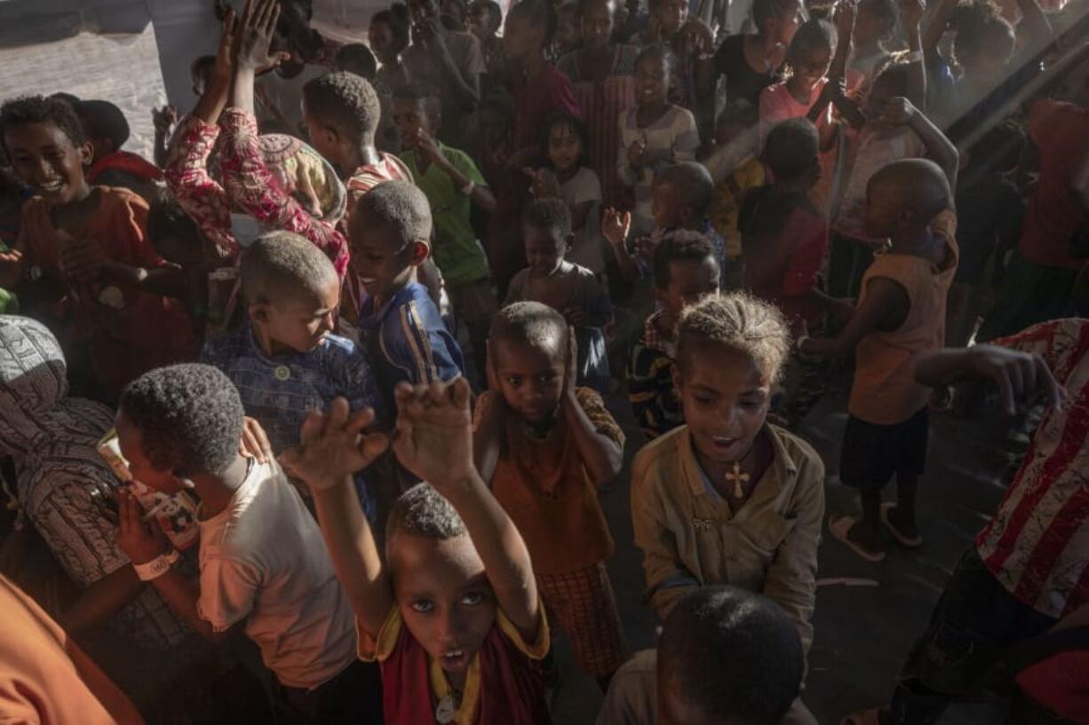 Tigray refugee children sing and dance inside a tent run by UNICEF for children&#039;s activities, in Umm Rakouba refugee camp in Qadarif, eastern Sudan, Thursday, Dec. 10, 2020.