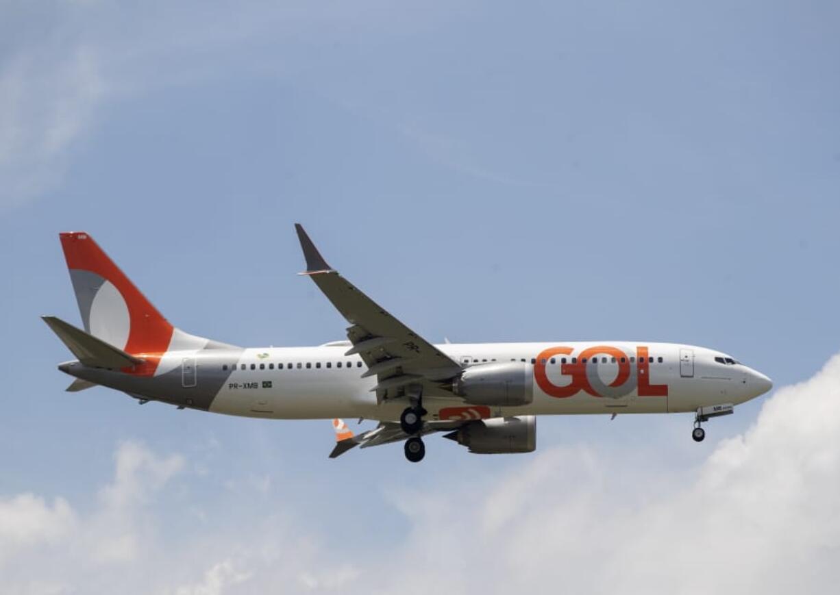 A Gol Airlines Boeing 737 Max plane approaches to land at the international airport in Guarulhos, near Sao Paulo, Brazil, Wednesday, Dec. 9, 2020. Commercial flights with Boeing 737 Max jetliners resumed Wednesday for the first time since they were grounded worldwide following two deadly accidents nearly two years ago. Brazil&#039;s Gol Airlines became the first in the world to return the planes to its active fleet.