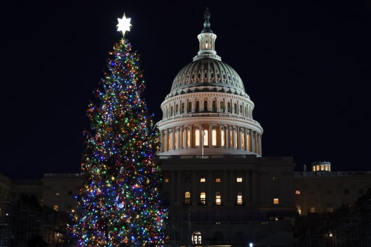 The 2020 U.S. Capitol Christmas Tree is lit after a ceremony on the West Front of Capitol Hill in Washington, with House Speaker Nancy Pelosi of Calif., Wednesday, Dec. 2, 2020. This year&#039;s tree is a 55-foot tall Engelmann spruce from Western Colorado and is decorated with handmade ornaments made by the people of Colorado. The Capitol Christmas Tree has been a tradition since 1964.