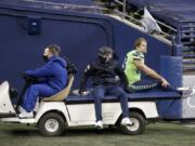 Seattle Seahawks tight end Greg Olsen (88) is taken off the field on a cart after going down with an injury against the Arizona Cardinals during the second half of an NFL football game, Thursday, Nov. 19, 2020, in Seattle.