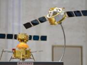 A model of China&#039;s Chang&#039;e 5 lunar orbiter and lander are displayed before a press conference at the State Council Information Office in Beijing, Thursday, Dec. 17, 2020. Following the successful return of moon rocks by its Chang&#039;e 5 robotic probe, China is preparing for future missions that could set the stage for an eventual lunar base to host human explorers.