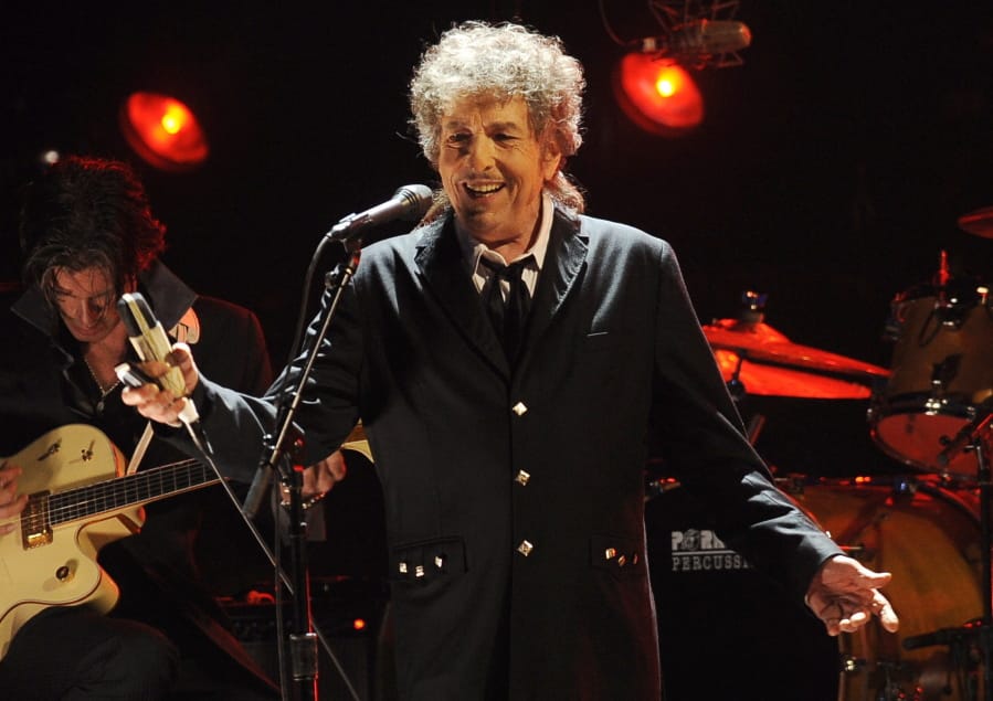 FILE - In this Jan. 12, 2012, file photo, Bob Dylan performs in Los Angeles. Universal Music Publishing Group is buying legendary singer Bob Dylan&#039;s entire catalog of songs. The company said Monday, Dec.