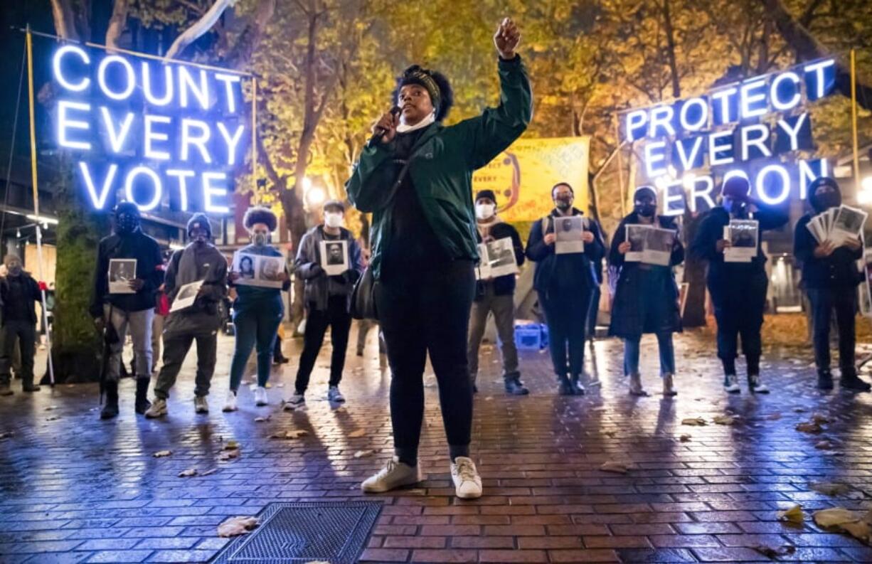 Travonna Thompson-Wiley, with the Black Action Coalition, speaks Nov. 4 at the &quot;Count Every Vote - Protect Every Person,&quot; rally and march in Occidental Park in Seattle. The coalition demanded that every vote is counted and orderly transition of power, as well as the elimination the Electoral College.