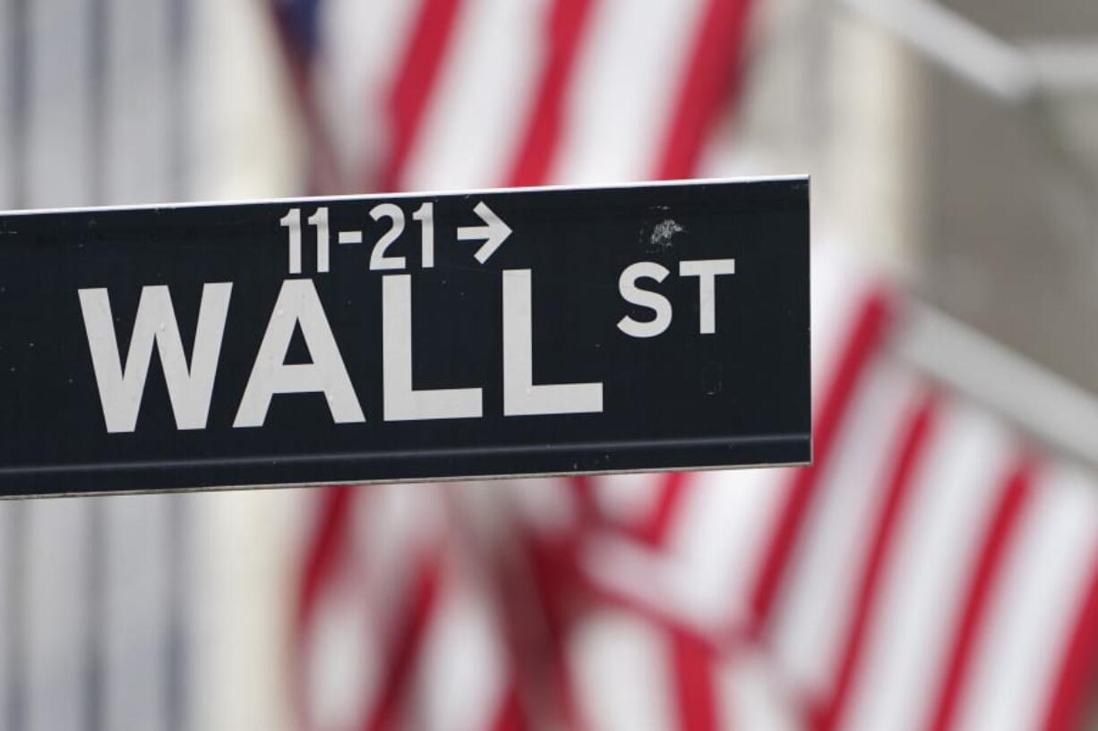 FILE - In this Nov. 23, 2020 file photo, a street sign is displayed at the New York Stock Exchange in New York.