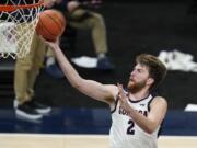 Gonzaga&#039;s Drew Timme goes to the basket against West Virginia in Indianapolis. It was the last game the Zags played and that was Dec. 2. Coach Mark Few of top-ranked Gonzaga says the suspension of basketball activities for the past two weeks because of the coronavirus pandemic has &#039;&#039;not helped us in any way, shape or form.?