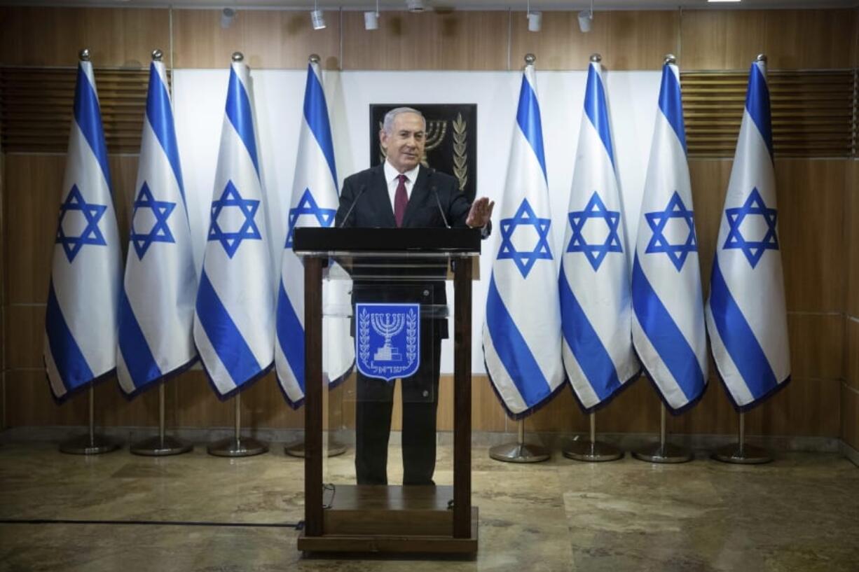 Israeli Prime Minister Benjamin Netanyahu delivers a statement Tuesday at the Israeli Knesset, or Parliament, in Jerusalem.