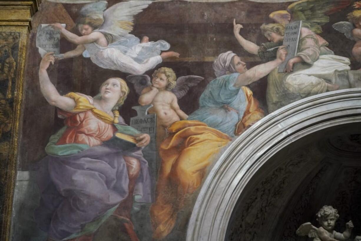 A detail of the 1514 fresco &quot;Sybils receiving instruction from Angels&quot; by Italian High Renaissance master painter Raffaello Sanzio, known as Raphael, adorns the inside of Santa Maria della Pace church, in Rome, Monday, Dec. 14, 2020. Like elsewhere in Europe, museums and art galleries in Italy were closed this fall to contain the spread of COVID-19, meaning art lovers must rely on virtual tours to catch a glimpse of the treasures held by famous institutions such as the Uffizi in Florence and the Vatican Museums in Rome. However, some exquisite gems of Italy&#039;s cultural heritage remain on display in real life inside the country&#039;s churches, some of which have collections of renaissance art and iconography that would be the envy of any museum.