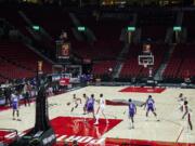 Portland Trail Blazers guard Gary Trent Jr. drives to the basket against the Sacramento Kings in an empty Moda Center during the first half of a preseason NBA basketball game in Portland, Ore., Friday, Dec. 11, 2020.