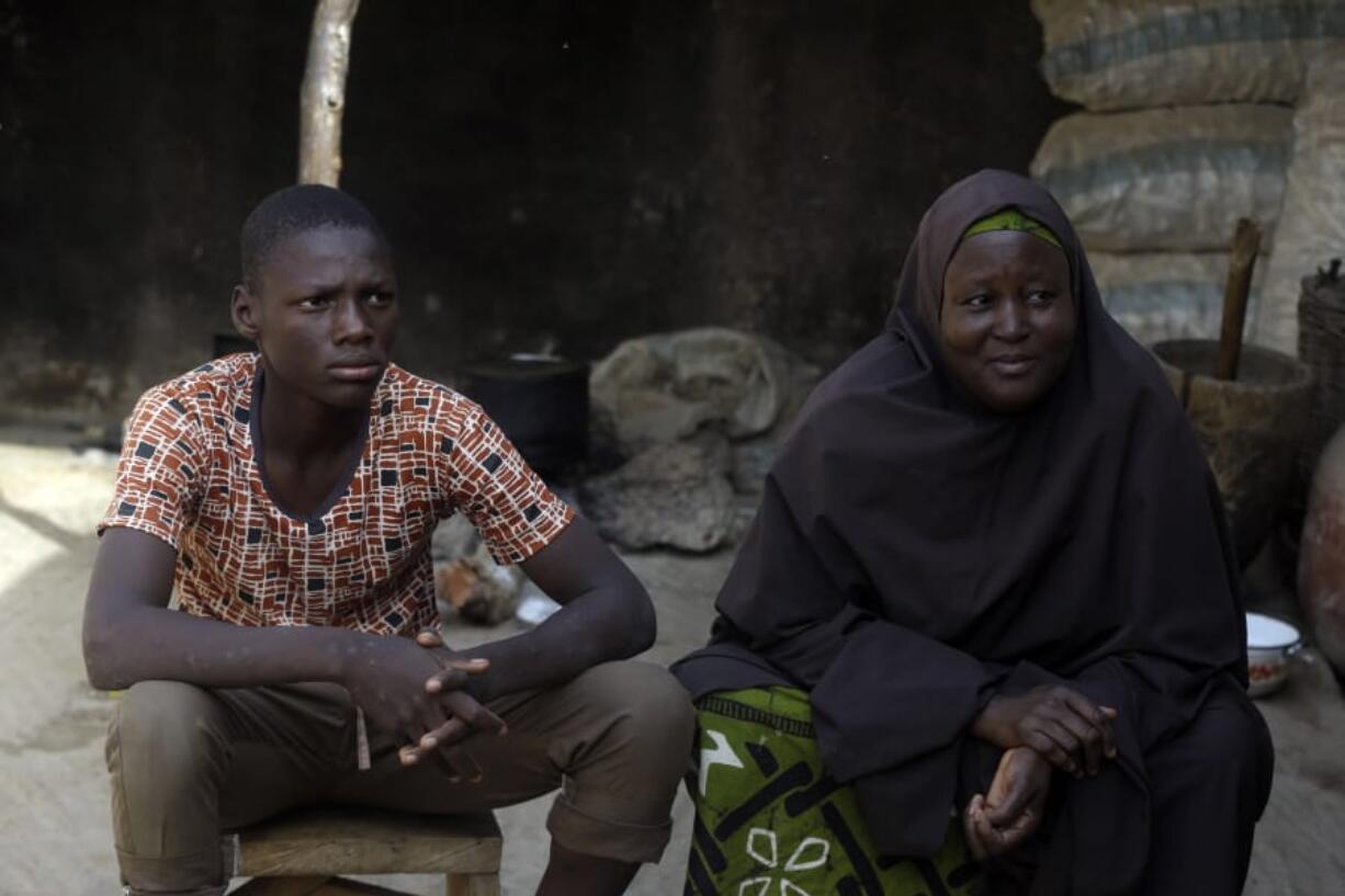 Murjanatu Rabiu, mother of freed schoolboy, Habubakar Liti, speaks with Associated Press at their family in Ketare, Nigeria, Saturday Dec. 19, 2020. &quot;By the time I saw my son, I didn&#039;t know when I started crying because of the condition I saw the children, that&#039;s why I started crying.&quot; Nigeria&#039;s freed schoolboys have reunited with their joyful parents after being held captive for nearly a week by gunmen allied with jihadist rebels in the country&#039;s northwest. Relieved parents hugged their sons tightly on Saturday in Kankara, where more than 340 boys were abducted from the Government Science Secondary school on the night of Dec. 11.