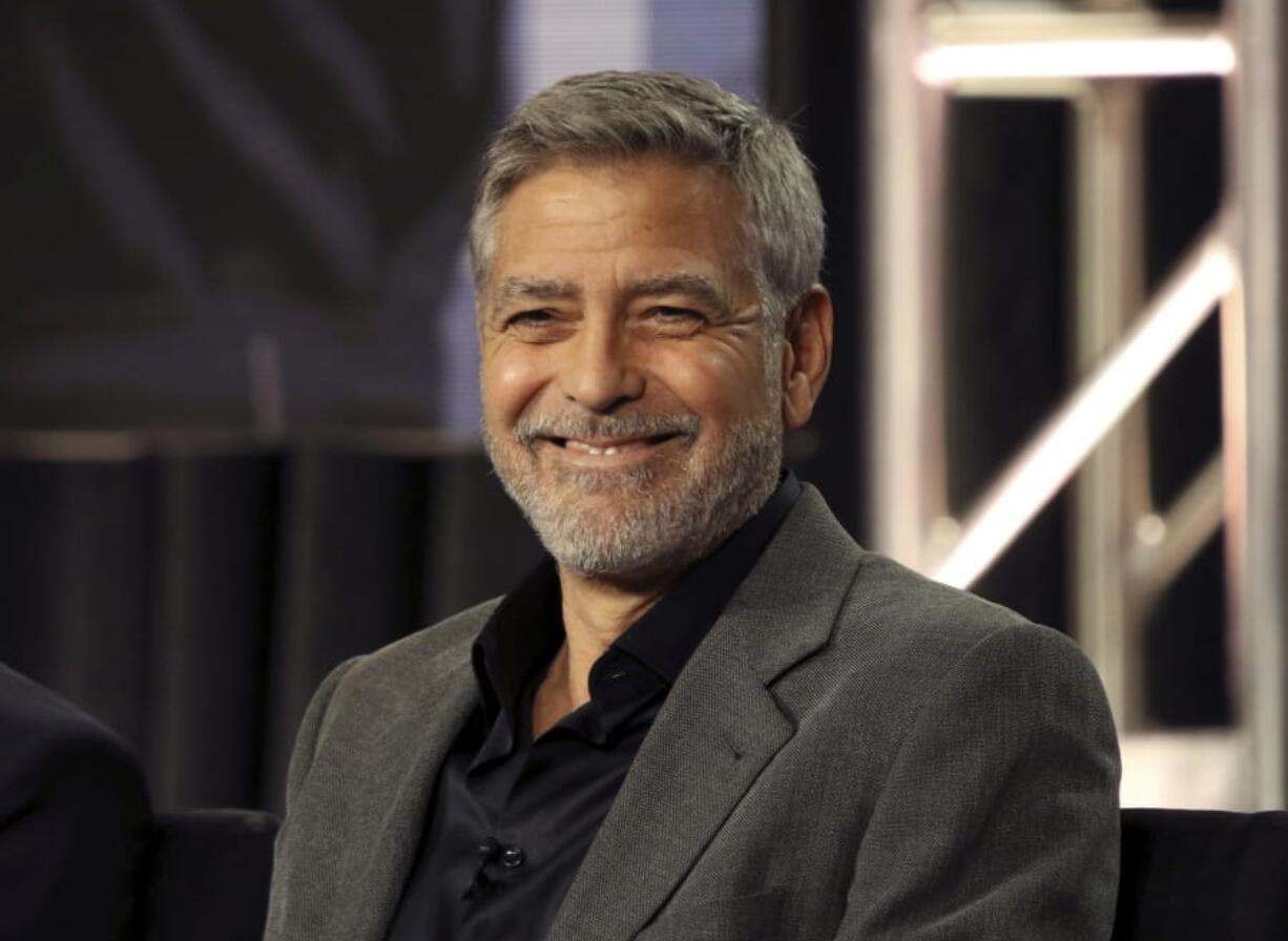 FILE - In this Feb. 11, 2019 file photo, George Clooney participates in the &quot;Catch-22&quot; panel during the Hulu presentation at the Television Critics Association Winter Press Tour at The Langham Huntington in Pasadena, Calif. In a Sunday, Nov. 29, 2020, interview on &quot;CBS Sunday Morning,&quot; Clooney said he&#039;s been cutting his own hair for more than two decades with a Flowbee device.