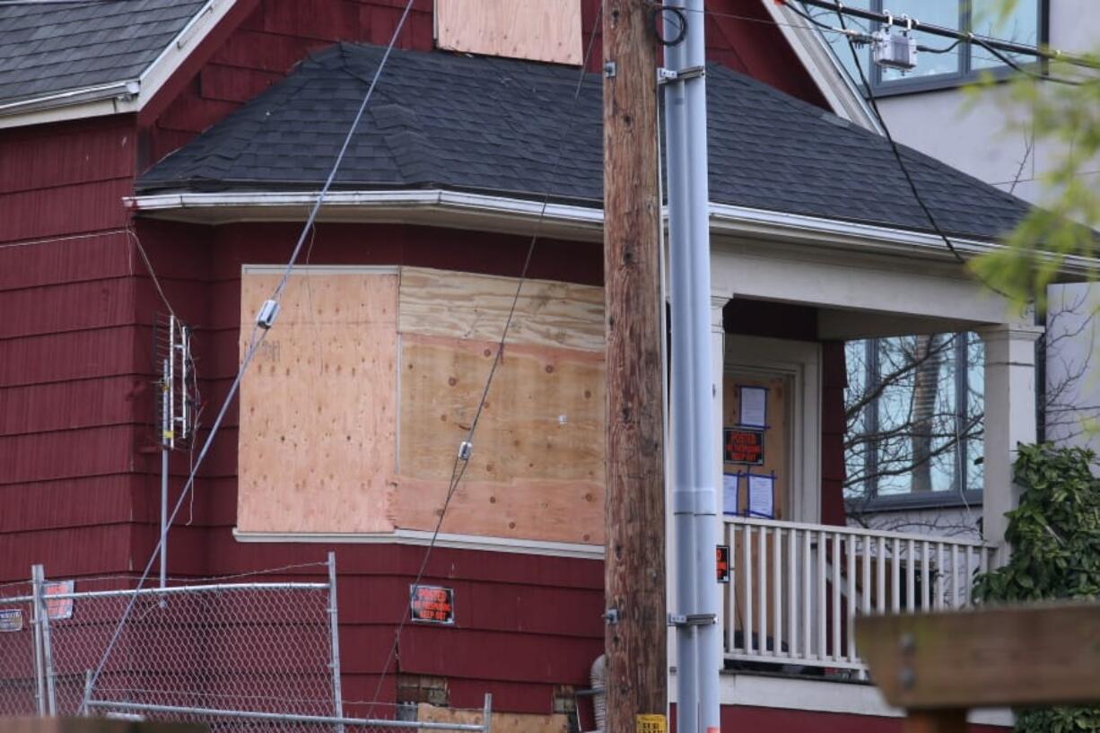 This Tuesday, Dec. 8, 2020 photo shows a home on North Mississippi Avenue in Portland, Ore. where protesters have camped to prevent a Black and Indigenous family from being forced to leave the foreclosed home, which has been dubbed the ,AuRed House on Mississippi,Au.