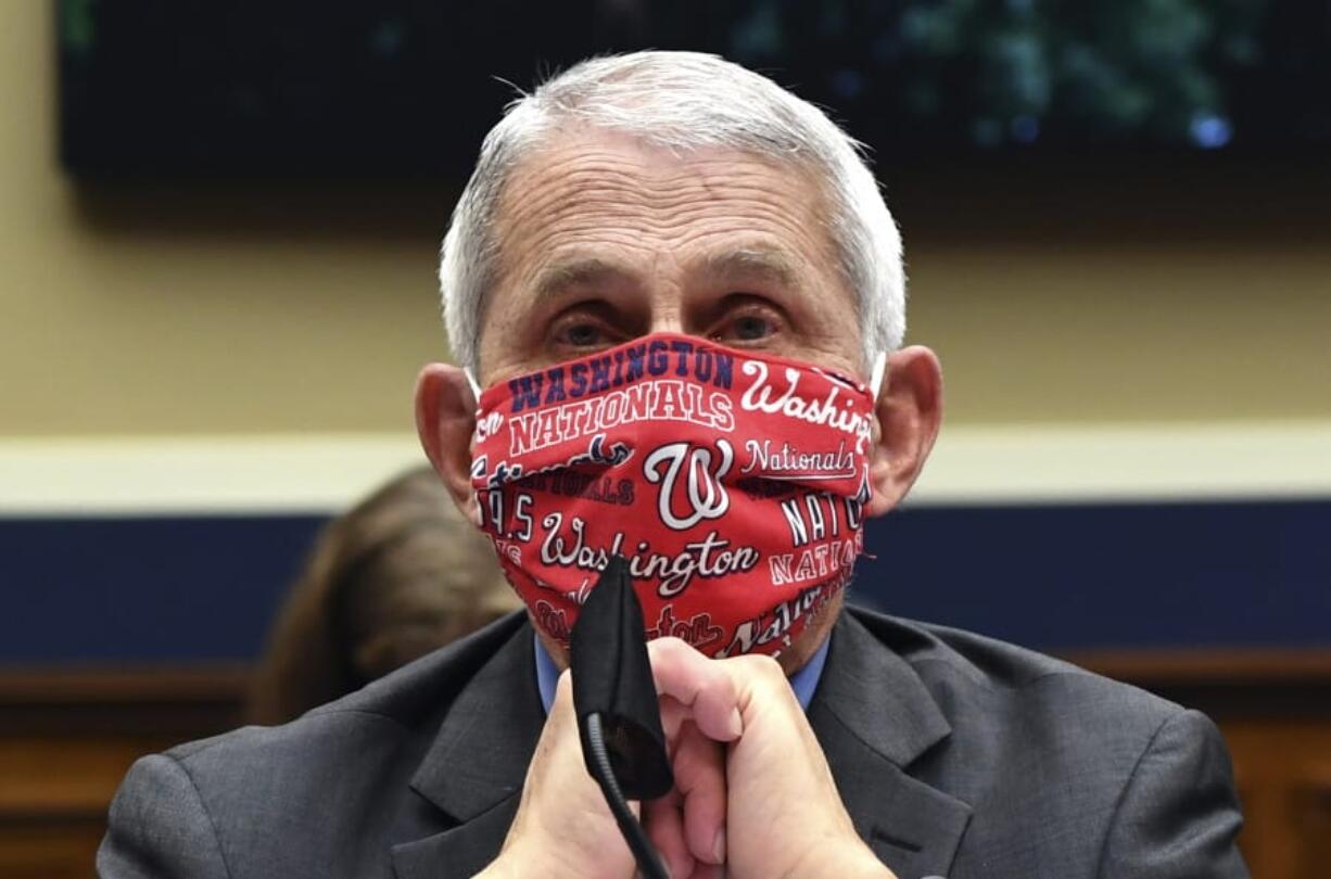 FILE- In this June 23, 2020 file photo, Director of the National Institute of Allergy and Infectious Diseases Dr. Anthony Fauci wears a face mask as he waits to testify before a House Committee on Energy and Commerce on the Trump administration&#039;s response to the COVID-19 pandemic on Capitol Hill in Washington. Made during a May 21, 2020 interview on CNN, Fauci&#039;s pleas for people to &quot;wear a mask&quot; to slow the spread of the coronavirus, tops a Yale Law School librarian&#039;s list of the most notable quotes of 2020.