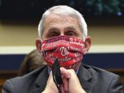 FILE- In this June 23, 2020 file photo, Director of the National Institute of Allergy and Infectious Diseases Dr. Anthony Fauci wears a face mask as he waits to testify before a House Committee on Energy and Commerce on the Trump administration&#039;s response to the COVID-19 pandemic on Capitol Hill in Washington. Made during a May 21, 2020 interview on CNN, Fauci&#039;s pleas for people to &quot;wear a mask&quot; to slow the spread of the coronavirus, tops a Yale Law School librarian&#039;s list of the most notable quotes of 2020.