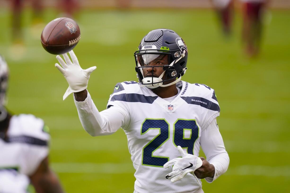 Seattle Seahawks free safety D.J. Reed (29) catching a ball before the start of an NFL football game against the Washington Football Team, Sunday, Dec. 20, 2020, in Landover, Md.