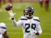 Seattle Seahawks free safety D.J. Reed (29) catching a ball before the start of an NFL football game against the Washington Football Team, Sunday, Dec. 20, 2020, in Landover, Md.