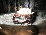 A Washington couple who had planned a trip to a Skamania County cabin over the weekend had to be rescued after their rental vehicle became stuck in more than a foot of snow on a U.S. Forest Service Road in Skamania County.