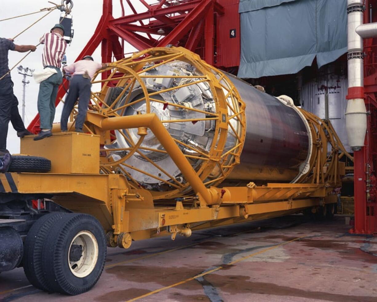 In this Aug. 13, 1965, photo technicians work on an Atlas Centaur 7 rocket at Cape Canaveral, Fla.