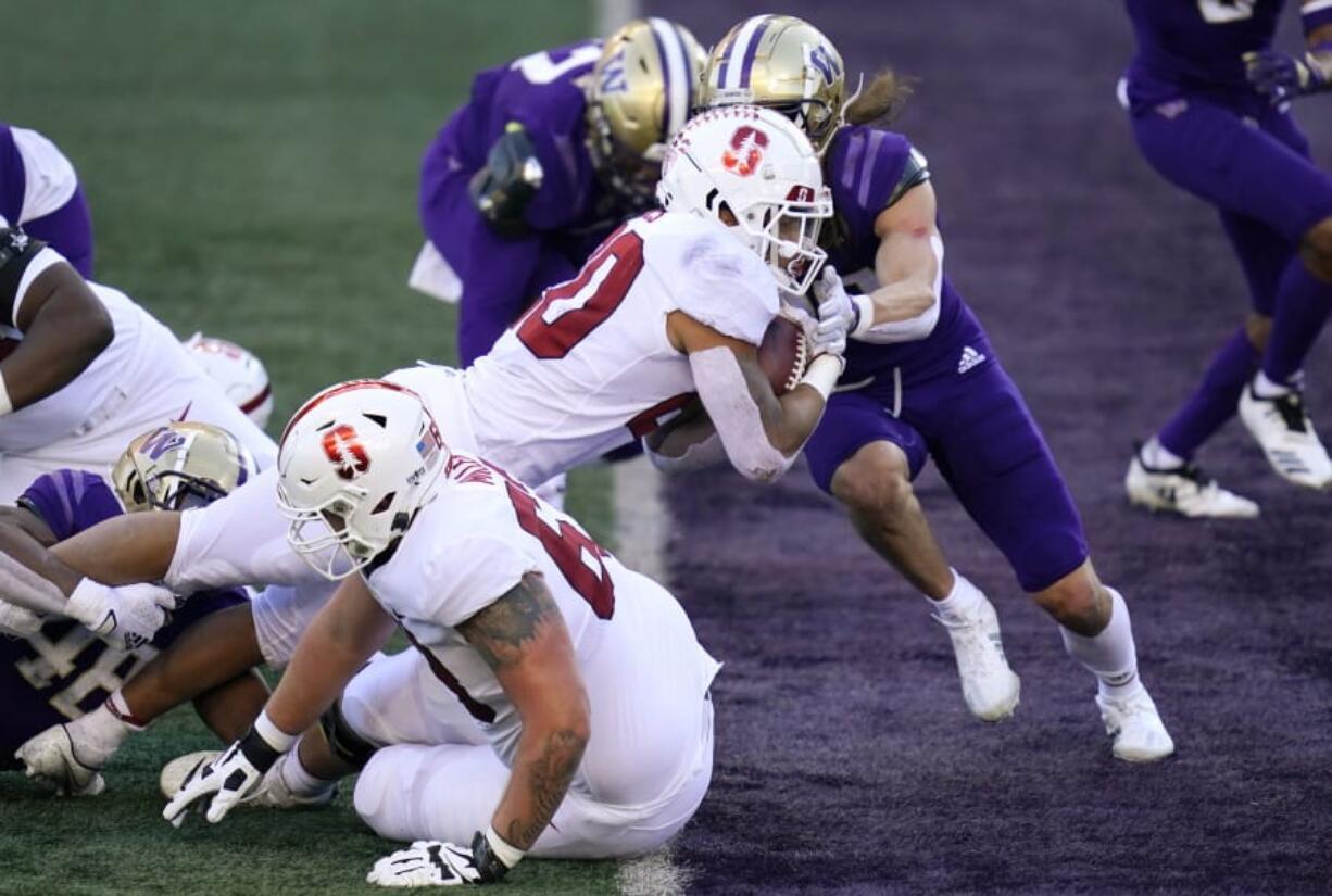 Stanford running back Austin Jones dives into the end zone on a touchdown run against Washington in the first half of an NCAA college football game Saturday, Dec. 5, 2020, in Seattle.