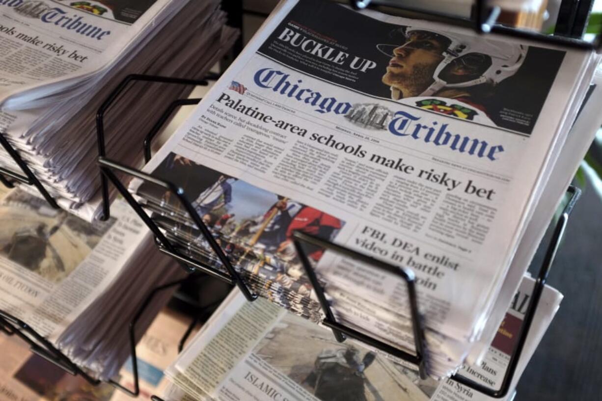 FILE - In this Monday, April 25, 2016, file photo, Chicago Tribune and other newspapers are displayed at Chicago&#039;s O&#039;Hare International Airport.  Hedge fund Alden, Tribune&#039;s largest shareholder, has offered to buy the rest of the newspaper publisher, Thursday, Dec. 31, 2020,  at a price that values it at $520.6 million.