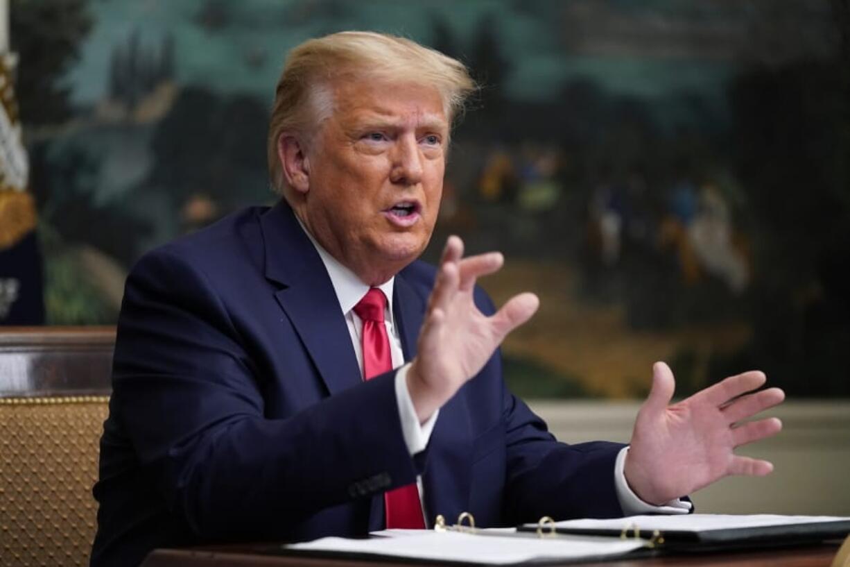 In this Nov. 26, 2020, photo, President Donald Trump speaks with reporters after participating in a video teleconference call with members of the military on Thanksgiving, at the White House in Washington. Trump has delivered a 46-minute diatribe against the election results that produced a win for Democrat Joe Biden, unspooling one misstatement after another to back his baseless claim that he really won.