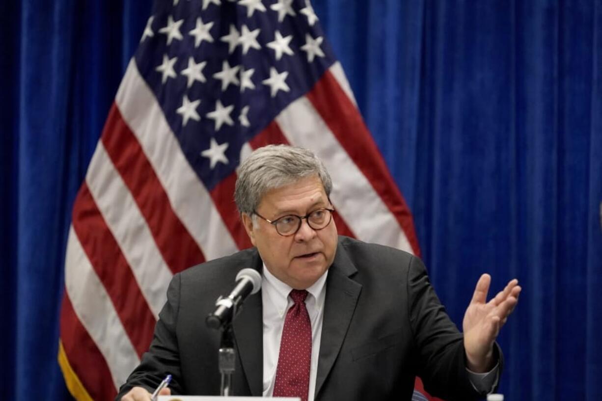 FILE - In this Oct. 15, 2020, file photo U.S. Attorney General William Barr speaks during a roundtable discussion on Operation Legend in St. Louis. Even before Barr issued a memo that authorized federal prosecutors across the country to investigate &quot;substantial allegations&quot; of voting irregularities if they exist, the Justice Department had already begun looking into two specific allegations.