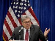 FILE - In this Oct. 15, 2020, file photo U.S. Attorney General William Barr speaks during a roundtable discussion on Operation Legend in St. Louis. Even before Barr issued a memo that authorized federal prosecutors across the country to investigate &quot;substantial allegations&quot; of voting irregularities if they exist, the Justice Department had already begun looking into two specific allegations.