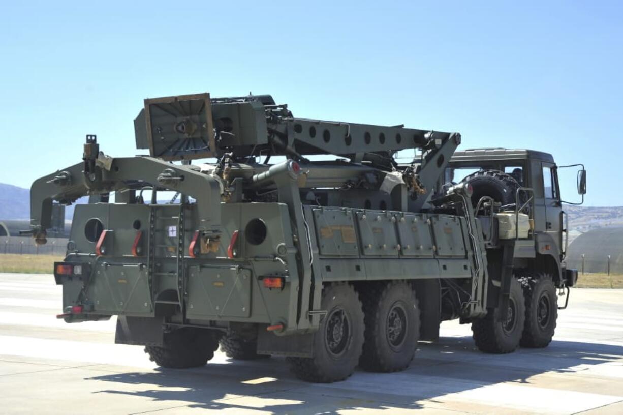 FILE - In this Tuesday, Aug. 27, 2019 file photo, a truck carrying parts of the S-400 air defense systems, exits a Russian transport aircraft after landing at Murted military airport outside Ankara, Turkey. NATO-member Turkey has tested its Russian-made advanced air defense missile system, Turkish media reports said Friday, Oct. 16, 2020, raising the specter of a new standoff with the United States.