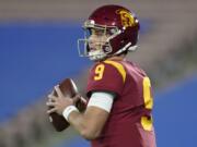 Southern California quarterback Kedon Slovis (9) looks for a receiver during the first quarter of an NCAA college football game against UCLA, Saturday, Dec 12, 2020, in Pasadena, Calif.