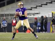 Washington quarterback Dylan Morris drops back to pass against Utah during the second half of an NCAA college football game Saturday, Nov. 28, 2020, in Seattle. (AP Photo/Ted S.