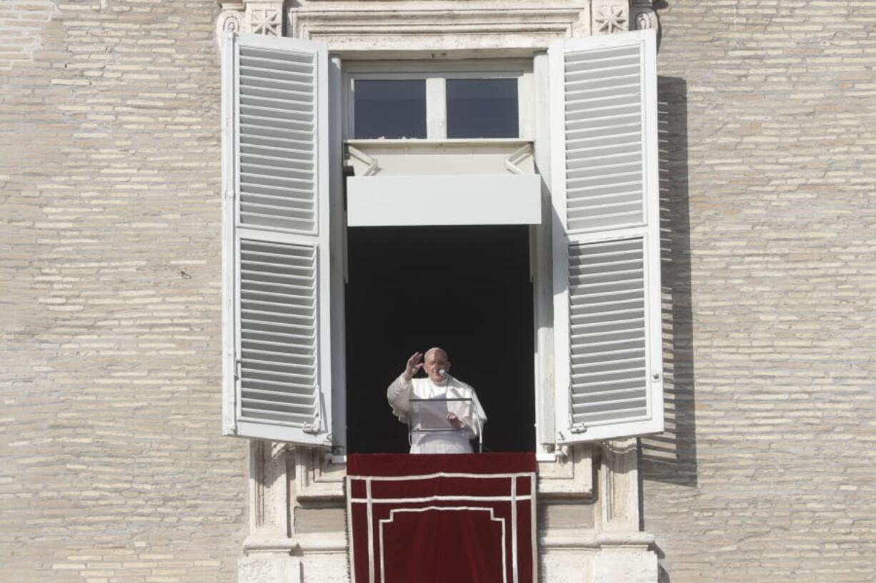 Pope Francis delivers the Angelus noon prayer in St. Peter&#039;s Square at the Vatican, Sunday, Dec. 20, 2020.