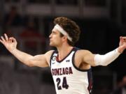 Gonzaga forward Corey Kispert (24) reacts after making a 3-point basket against Virginia during the first half Saturday, Dec. 26, 2020, in Fort Worth, Texas. Kispert made a career-high nine 3-pointers in the game, scoring 32 points as the Bulldogs won 98-75.