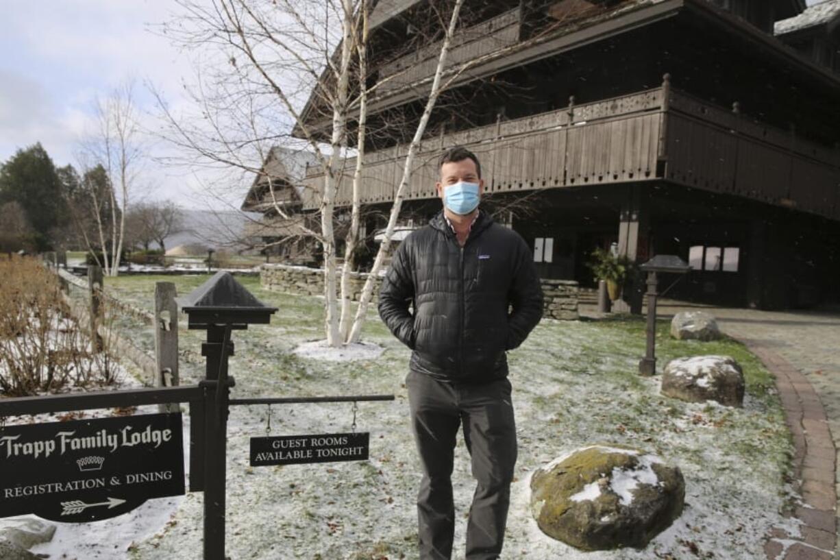 Bob Schwartz, the director of marketing of the Trapp Family Lodge poses outside the lodge on Tuesday, Dec. 15, 2020 in Stowe, Vt. Quarantine rules imposed in an attempt to stop the spread of novel coronavirus are affecting business during the normally busy holiday season. He says the rules are frustrating but be understands the need for them. He&#039;s looking forward to a time when the pandemic is over.