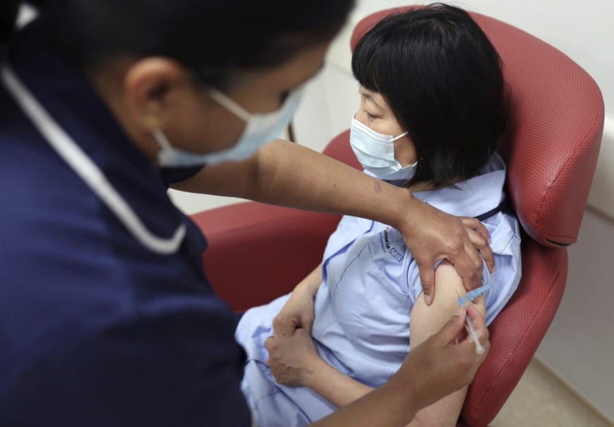 Nurses at the Royal Free Hospital, London, simulate the administration of the Pfizer vaccine to support staff training ahead of the rollout, in London, Friday Dec. 4, 2020.