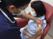 Nurses at the Royal Free Hospital, London, simulate the administration of the Pfizer vaccine to support staff training ahead of the rollout, in London, Friday Dec. 4, 2020.