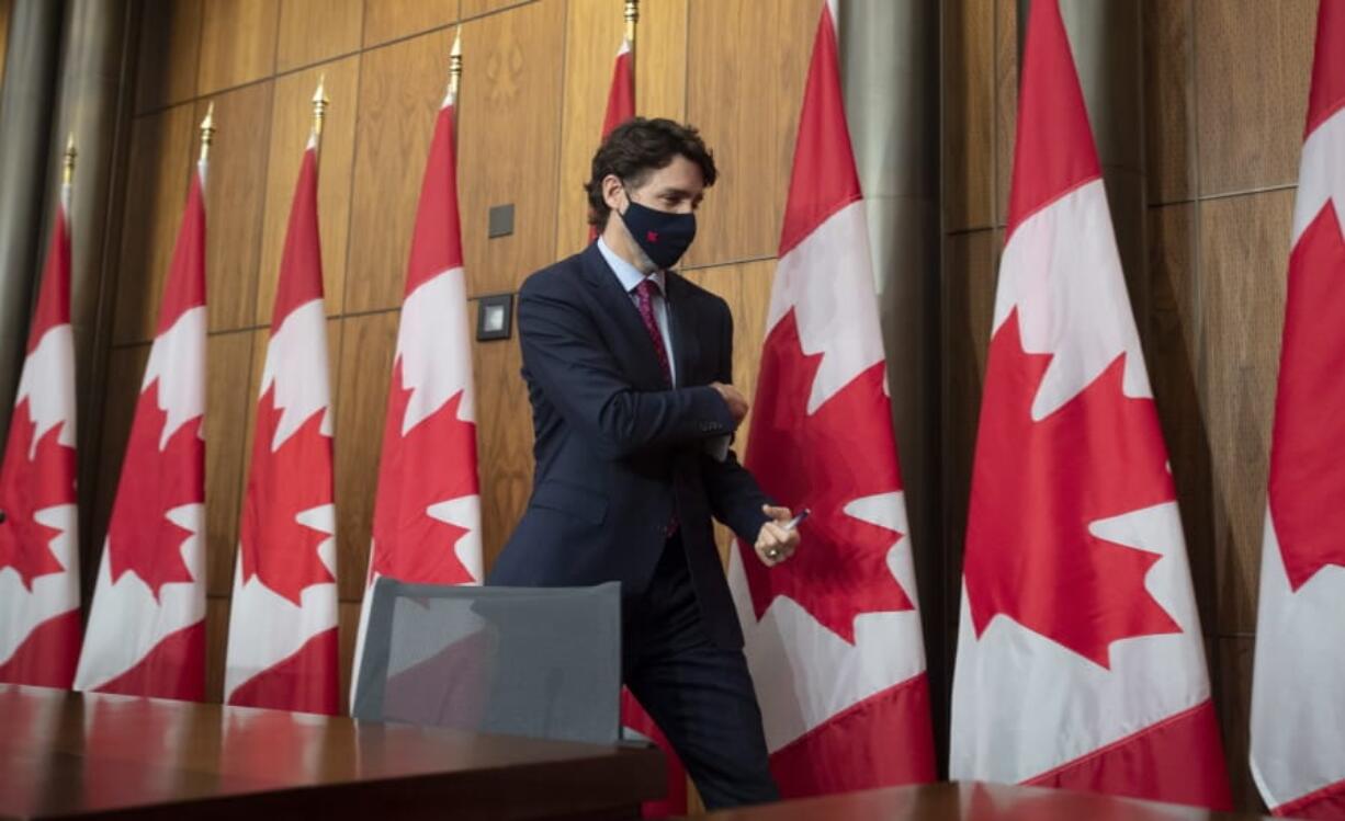 Prime Minister Justin Trudeau leaves a news conference in Ottawa, Monday, Dec. 7, 2020.