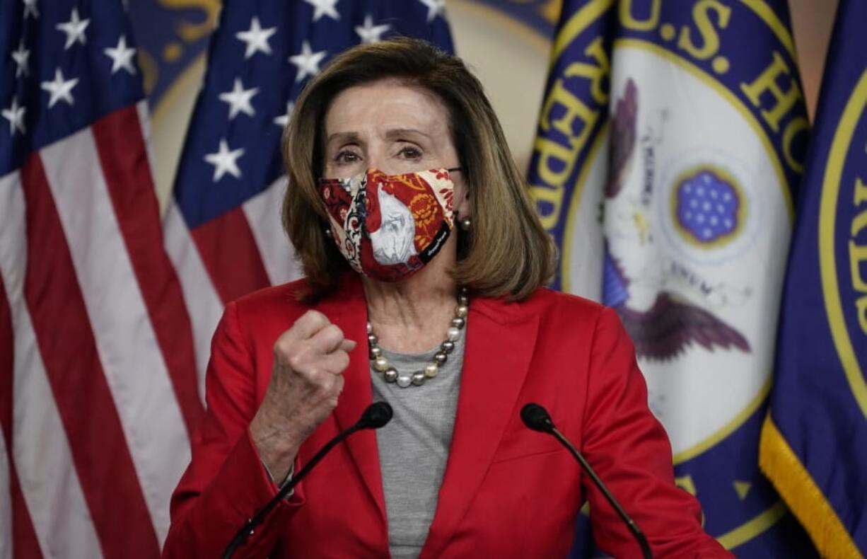 House Speaker Nancy Pelosi of Calif., speaks to the media, Wednesday Dec. 30, 2020, on Capitol Hill in Washington.