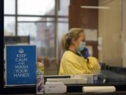 FILE - In this Nov. 24, 2020, file photo, registered nurse Chrissie Burkhiser works in the emergency room at Scotland County Hospital in Memphis, Mo. Scientists say there is reason for concern but not alarm about new strains of the coronavirus, especially the one currently spreading in England.