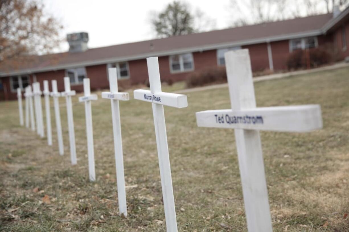 White crosses on the lawn of Good Samaritan Society nursing home Dec. 8, 2020, in Canton, S.D., commemorate residents who have died in recent weeks of the coronavirus.